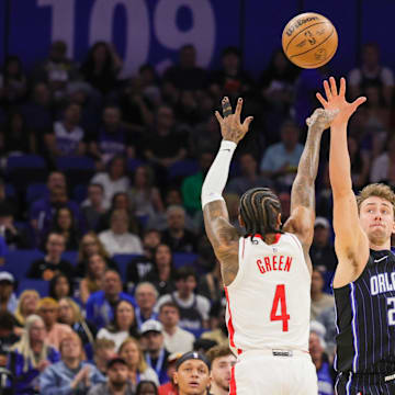 Houston Rockets guard Jalen Green (4) shoots against Orlando Magic forward Franz Wagner (22) during the first quarter at Kia Center.