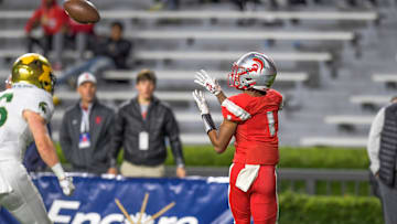 Saraland's Ryan Williams catches a touchdown pass in first half action against Mountain Brook during