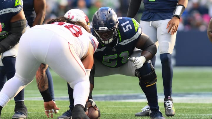 Oct 22, 2023; Seattle, Washington, USA; Seattle Seahawks center Olu Oluwatimi prepares to snap during the second half against the Arizona Cardinals at Lumen Field. Mandatory Credit: Steven Bisig-USA TODAY Sports