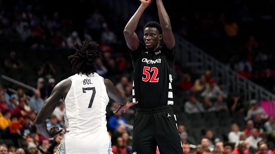 Cincinnati center Moustapha Thiam makes a basket from three-point range.