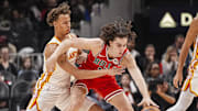 Nov 9, 2024; Atlanta, Georgia, USA; Atlanta Hawks guard Dyson Daniels (5) and Chicago Bulls guard Josh Giddey (3) battle for the ball during the first half at State Farm Arena. Mandatory Credit: Dale Zanine-Imagn Images