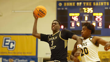 Utah Prep's AJ Dybantsa drives to the basket past Highland School defender Chance Perkins during a game at Emmanuel College in Boston on Tuesday, Nov. 5, 2024.