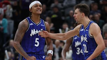 Nov 2, 2023; Salt Lake City, Utah, USA; Orlando Magic forward Paolo Banchero (5) reacts with forward Franz Wagner (22) after making a shot against the Utah Jazz in the fourth quarter at the Delta Center. Mandatory Credit: Rob Gray-Imagn Images