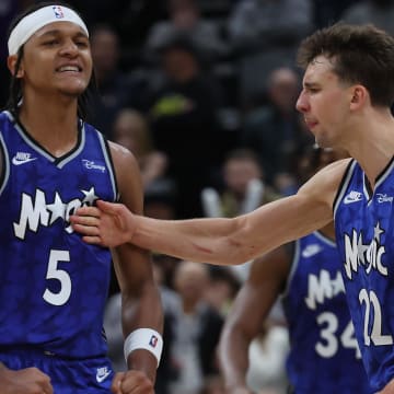 Nov 2, 2023; Salt Lake City, Utah, USA; Orlando Magic forward Paolo Banchero (5) reacts with forward Franz Wagner (22) after making a shot against the Utah Jazz in the fourth quarter at the Delta Center. 