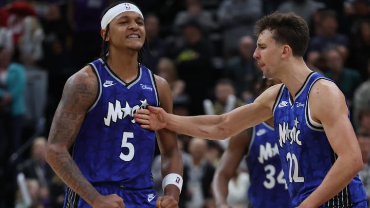 Nov 2, 2023; Orlando Magic forward Paolo Banchero (5) reacts with forward Franz Wagner (22) after making a shot against the Utah Jazz in the fourth quarter at the Delta Center.