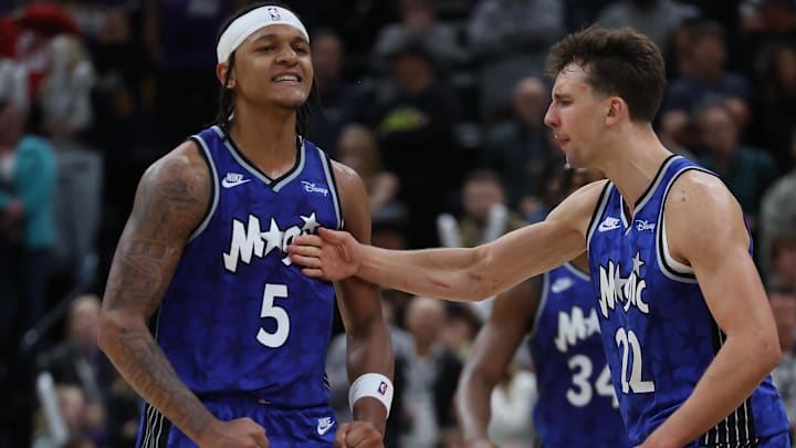 Orlando Magic forward Paolo Banchero (5) reacts with forward Franz Wagner (22) after making a shot against the Utah Jazz in the fourth quarter at the Delta Center.