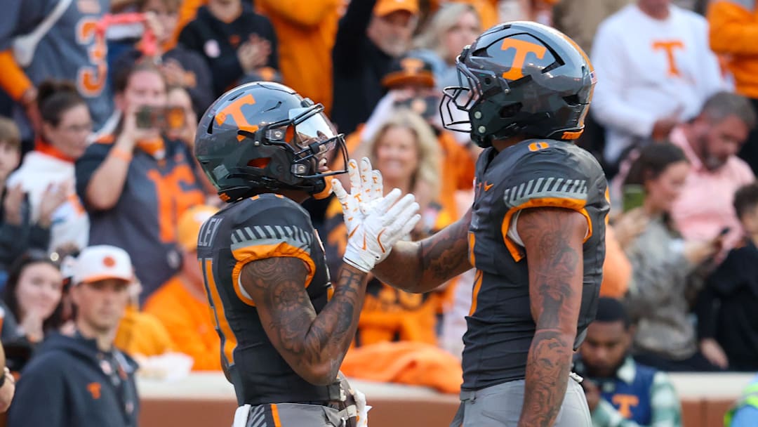 Nov 15, 2025; Knoxville, Tennessee, USA;  Tennessee Volunteers wide receiver Braylon Staley (14) and tight end Ethan Davis (0) celebrate a touchdown against the New Mexico State Aggies during the first half at Neyland Stadium. Mandatory Credit: Randy Sartin-Imagn Images