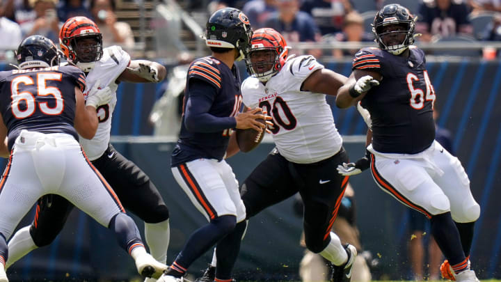 Cincinnati defensive tackle Kris Jenkins Jr.  breaks through a block from Bears guard Nate Davis to sack quarterback Caleb Williams.