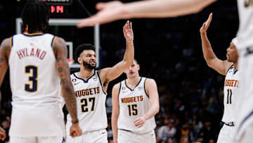 Jan 9, 2023; Denver, Colorado, USA; Denver Nuggets guard Jamal Murray (27) reacts with forward Bruce Brown (11) and guard Bones Hyland (3) and center Nikola Jokic (15) in the fourth quarter against the Los Angeles Lakers at Ball Arena. Mandatory Credit: Isaiah J. Downing-Imagn Images
