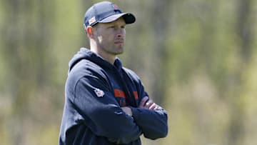 Chicago Bears head coach Ben Johnson (R) looks on during the Rookie Minicamp at Halas Hall.