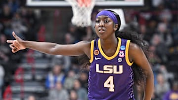 Mar 30, 2025; Spokane, WA, USA; LSU Lady Tigers guard Flau'Jae Johnson (4) reacts after play against the UCLA Bruins during the first half of a Elite 8 NCAA Tournament basketball game at Spokane Arena. Mandatory Credit: James Snook-Imagn Images