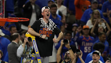 Apr 7, 2025; San Antonio, TX, USA; Florida Gators head coach Todd Golden reacts after cutting the net in the national championship game of the Final Four of the 2025 NCAA Tournament at the Alamodome.Mandatory Credit: Scott Wachter-Imagn Images