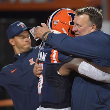 Aug 29, 2024; Champaign, Illinois, USA;  Illinois Fighting Illini head coach Bret Bielema hugs running back Josh McCray (6) before the first half at Memorial Stadium. Mandatory Credit: Ron Johnson-Imagn Images