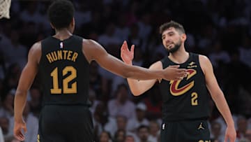 Apr 28, 2025; Miami, Florida, USA; Cleveland Cavaliers guard Ty Jerome (2) shakes hands with forward De'Andre Hunter (12) against the Miami Heat in the second quarter during game four for the first round of the 2025 NBA Playoffs at Kaseya Center. Mandatory Credit: Sam Navarro-Imagn Images
