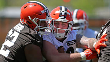 Cleveland Browns defensive tackle Mason Graham (94) tries to squeeze around center Justin Osborne during NFL rookie minicamp at the Cleveland Browns training facility on Friday, May 9, 2025, in Berea, Ohio.