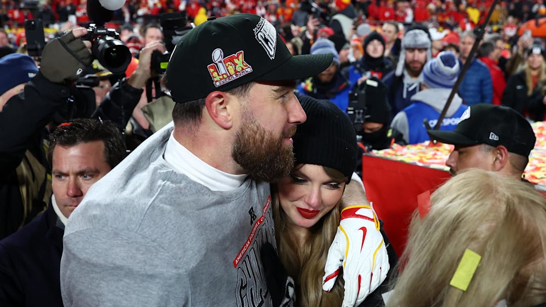 Jan 26, 2025; Kansas City, MO, USA; Recording artist Taylor Swift  and Kansas City Chiefs tight end Travis Kelce (87) react after the AFC Championship game against the Buffalo Bills at GEHA Field at Arrowhead Stadium. 