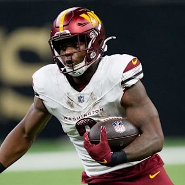 Washington Commanders running back Brian Robinson Jr. runs against the New Orleans Saints.