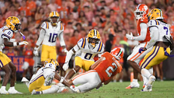 LSU Tigers safety Jardin Gilbert (2) tackles Clemson Tigers quarterback Cade Klubnik (2) Saturday, Aug. 30, 2025 during the NCAA football game at Memorial Stadium in Clemson, South Carolina.