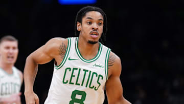 Oct 29, 2025; Boston, Massachusetts, USA; Boston Celtics forward Josh Minott (8) returns the ball against the Cleveland Cavaliers in the second quarter at TD Garden. Mandatory Credit: David Butler II-Imagn Images