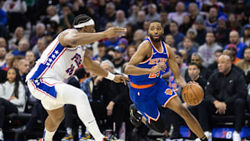 Jan 15, 2025; Philadelphia, Pennsylvania, USA; New York Knicks forward Mikal Bridges (25) dribbles the ball against Philadelphia 76ers forward Guerschon Yabusele (28) during the second quarter at Wells Fargo Center. Mandatory Credit: Bill Streicher-Imagn Images