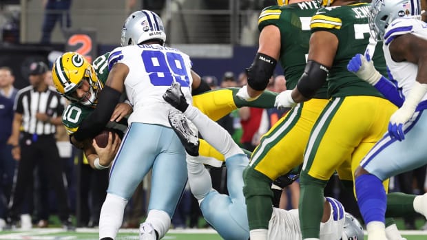 Dallas Cowboys defensive end Chauncey Golston (99) sacks Green Bay Packers quarterback Jordan Love