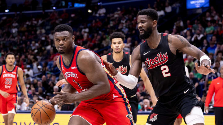 Mar 16, 2024; New Orleans, Louisiana, USA;  New Orleans Pelicans forward Zion Williamson (1) dribbles against Portland Trail Blazers center Deandre Ayton (2) during the second half at Smoothie King Center. Mandatory Credit: Stephen Lew-USA TODAY Sports