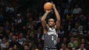 Apr 3, 2025; Brooklyn, New York, USA; Brooklyn Nets forward Dariq Whitehead (0) shoots a three point jump shot against the Minnesota Timberwolves during the first half at Barclays Center. Mandatory Credit: Gregory Fisher-Imagn Images