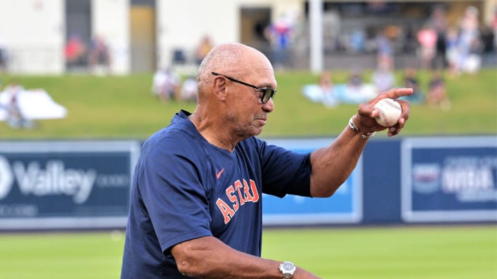 Reggie Jackson walks onto the field in front of a cheering stadium at Ballpark of the Palm Beaches, setting up to throw the game's ceremonial first pitch in celebration of his documentary's upcoming debut on Amazon Prime (Mar. 18, 2023).