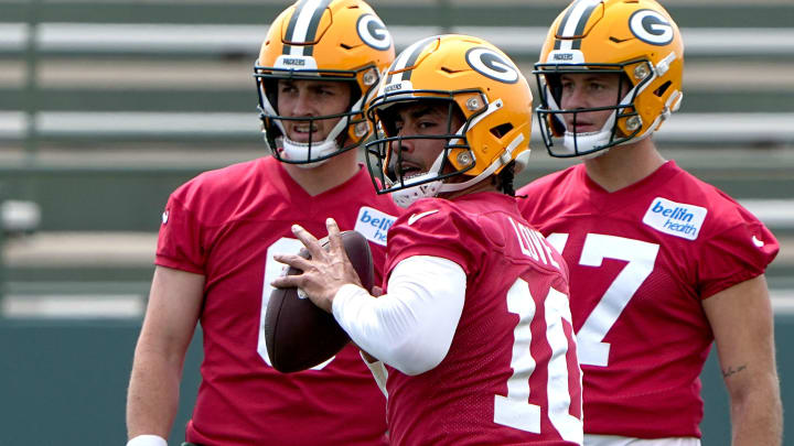 Green Bay Packers quarterback Jordan Love is flanked by Sean Clifford and rookie MIchael Pratt.