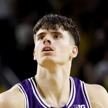 Jan 19, 2025; Ann Arbor, Michigan, USA;  Northwestern Wildcats guard Brooks Barnhizer (13) takes a free throw in overtime against the Michigan Wolverines at Crisler Center. Mandatory Credit: Rick Osentoski-Imagn Images
