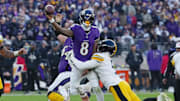 Dec 7, 2025; Baltimore, Maryland, USA; Baltimore Ravens quarterback Lamar Jackson (8) passes the ball while defended by Pittsburgh Steelers linebacker Alex Highsmith (56) and linebacker Nick Herbig (51) during the second half at M&T Bank Stadium. Mandatory Credit: Mitch Stringer-Imagn Images