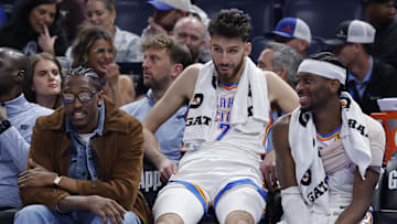 Nov 12, 2025; Oklahoma City, Oklahoma, USA; Oklahoma City Thunder guard Jalen Williams (8), center Chet Holmgren (7), and guard Shai Gilgeous-Alexander (2) talk while sitting on the bench during the fourth quarter against the Los Angeles Lakers at Paycom Center. Mandatory Credit: Alonzo Adams-Imagn Images