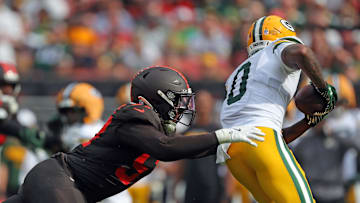 Cleveland Browns defensive end Isaiah McGuire (57) dives for Green Bay Packers wide receiver Matthew Golden (0) during the second half of an NFL football game at Huntington Bank Field, Sept. 21, 2025, in Cleveland, Ohio.