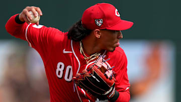 Cincinnati Reds shortstop Edwin Arroyo throws to first base