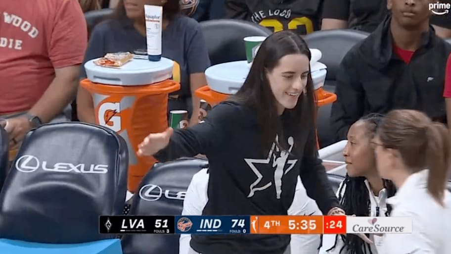 Clark high fives Fever coach White from the bench | Screengrab via Prime Video