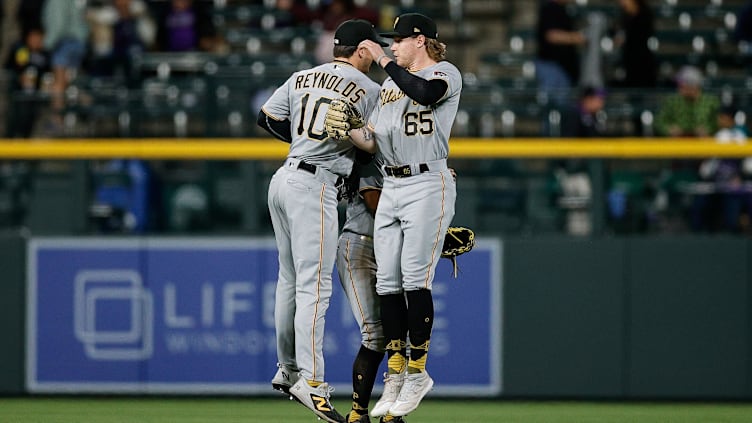 Apr 18, 2023; Denver, Colorado, USA; Pittsburgh Pirates right fielder Jack Suwinski (65) and left