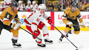 Nov 11, 2024; Las Vegas, Nevada, USA; Carolina Hurricanes right wing Jackson Blake (53) controls the puck ahead of Vegas Golden Knights defenseman Kaedan Korczak (6) during the first period at T-Mobile Arena. Mandatory Credit: Stephen R. Sylvanie-Imagn Images