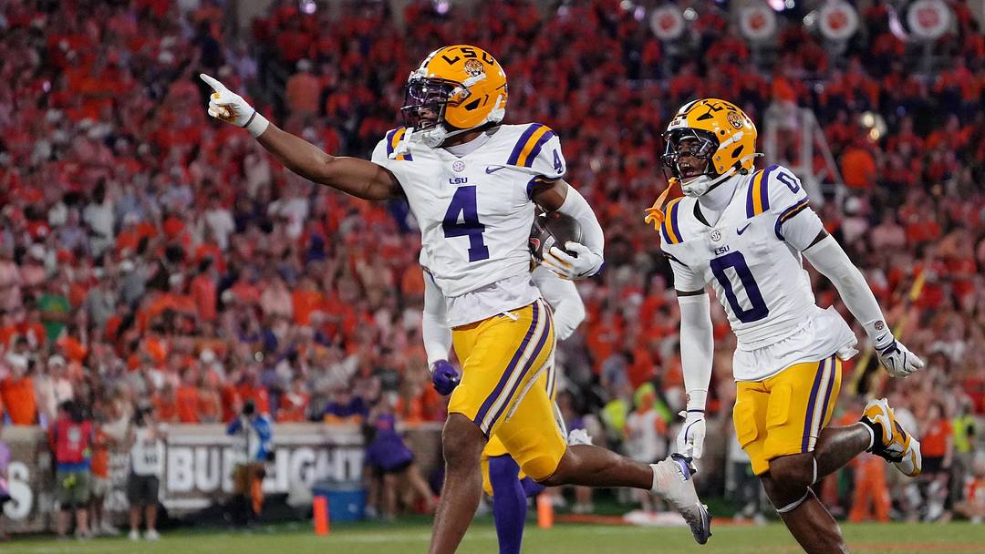 Aug 30, 2025; Clemson, South Carolina, USA; LSU Tigers cornerback Mansoor Delane (4) celebrates with safety Tamarcus Cooley (0) after a play against the Clemson Tigers during the second half at Memorial Stadium. Mandatory Credit: Ken Ruinard-USA TODAY Network via Imagn Images