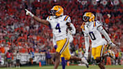 LSU Tigers cornerback Mansoor Delane celebrates with safety Tamarcus Cooley after an interception against the Clemson Tigers