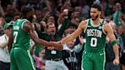Boston Celtics forward Jayson Tatum (0) celebrates with guard Jaylen Brown (7) after a play against the Dallas Mavericks in game five of the 2024 NBA Finals at TD Garden. 