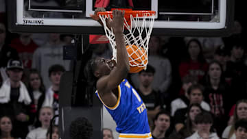 Feb 2, 2025; Cincinnati, Ohio, USA;  West Virginia Mountaineers center Eduardo Andre (0) dunks the ball against the Cincinnati Bearcats in the first half at Fifth Third Arena. Mandatory Credit: Aaron Doster-Imagn Images