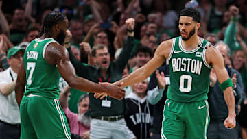 Boston Celtics forward Jayson Tatum (0) celebrates with guard Jaylen Brown (7) after a play against the Dallas Mavericks in game five of the 2024 NBA Finals at TD Garden. 