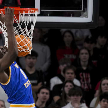 Feb 2, 2025; Cincinnati, Ohio, USA;  West Virginia Mountaineers center Eduardo Andre (0) dunks the ball against the Cincinnati Bearcats in the first half at Fifth Third Arena. Mandatory Credit: Aaron Doster-Imagn Images