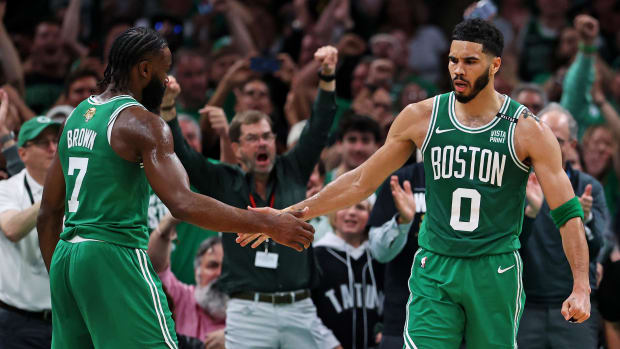 Celtics Jayson Tatum (0) celebrates with Jaylen Brown (7) after a play vs. the Mavericks in Game 5 of the 2024 NBA Finals.