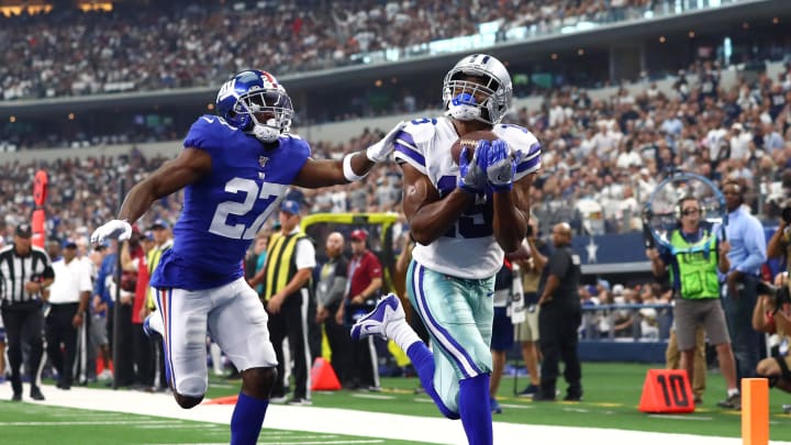 Sep 8, 2019; Arlington, TX, USA; Dallas Cowboys receiver Amari Cooper (19) catches a second quarter touchdown pass against New York Giants cornerback DeAndre Baker (27) at AT&T Stadium. 