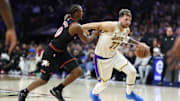 Dec 7, 2025; Philadelphia, Pennsylvania, USA; Los Angeles Lakers guard Luka Doncic (77) dribbles past Philadelphia 76ers guard Tyrese Maxey during the second quarter at Xfinity Mobile Arena. Mandatory Credit: Bill Streicher-Imagn Images