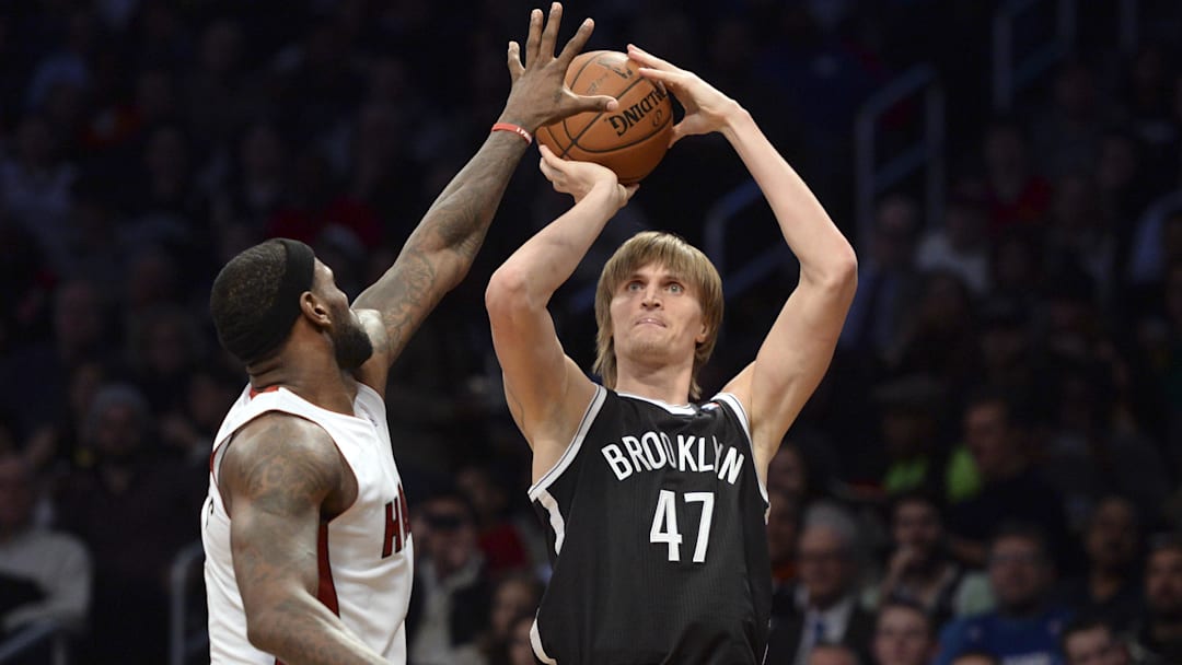 Jan 10, 2014; Brooklyn, NY, USA; Brooklyn Nets small forward Andrei Kirilenko (47) shoots over Miami Heat small forward LeBron James (6) during the second half at Barclays Center. The Brooklyn Nets won the game 104-95 in double overtime. Mandatory Credit: Joe Camporeale-Imagn Images