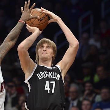 Jan 10, 2014; Brooklyn, NY, USA; Brooklyn Nets small forward Andrei Kirilenko (47) shoots over Miami Heat small forward LeBron James (6) during the second half at Barclays Center. The Brooklyn Nets won the game 104-95 in double overtime. Mandatory Credit: Joe Camporeale-Imagn Images