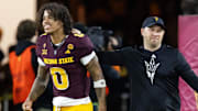 Nov 28, 2025; Tempe, Arizona, USA; Arizona State Sun Devils wide receiver Jordyn Tyson (0) with head coach Kenny Dillingham against the Arizona Wildcats during the 99th Territorial Cup at Mountain America Stadium. Mandatory Credit: Mark J. Rebilas-Imagn Images