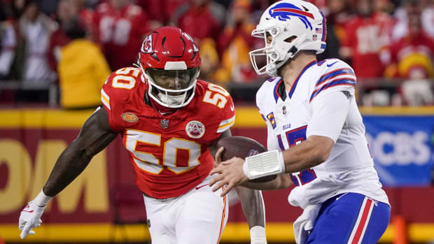 Kansas City Chiefs linebacker Willie Gay (50) runs down Buffalo Bills quarterback Josh Allen (17) 